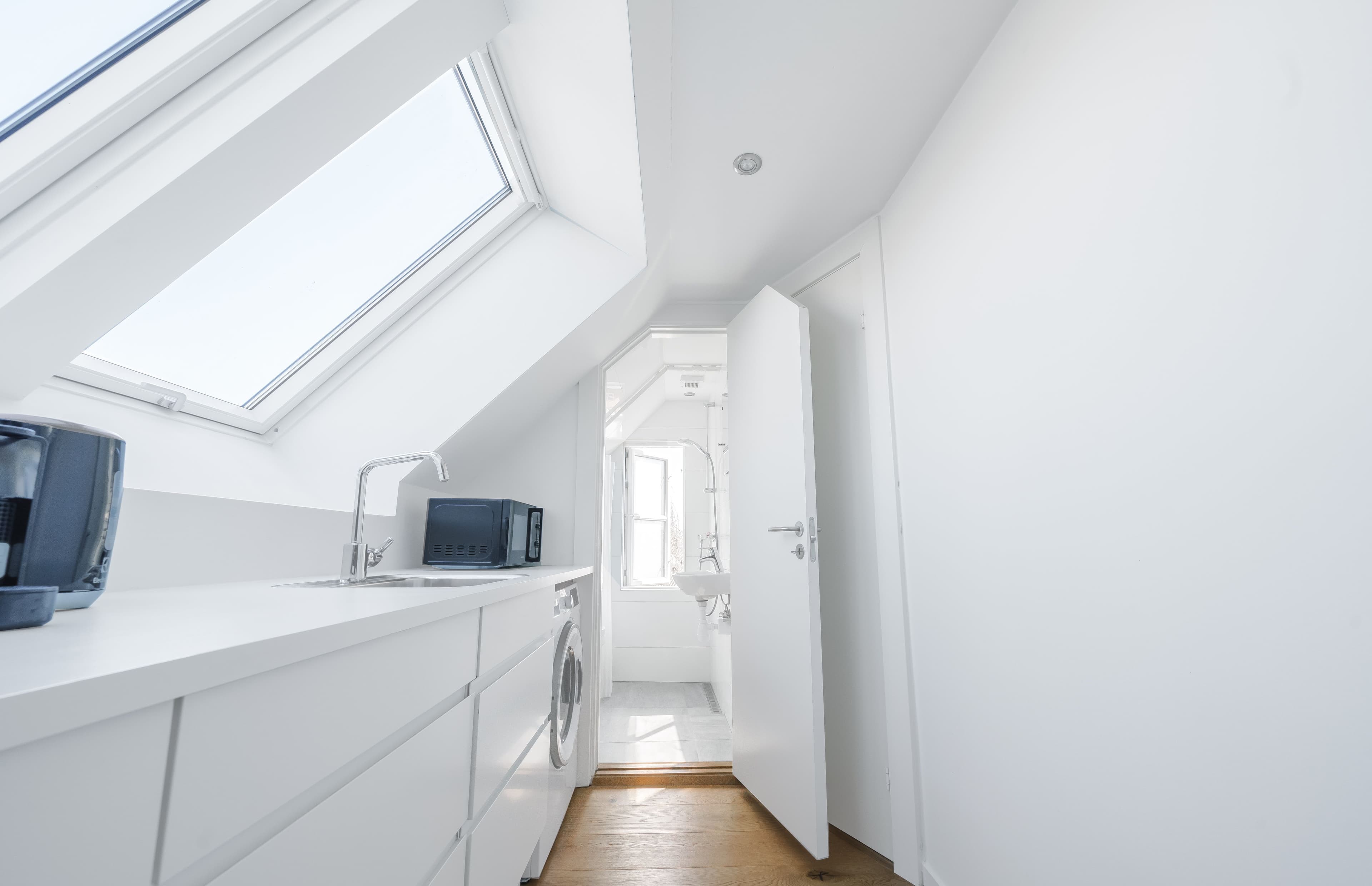 An attic accommodation a kitchen and a bathroom