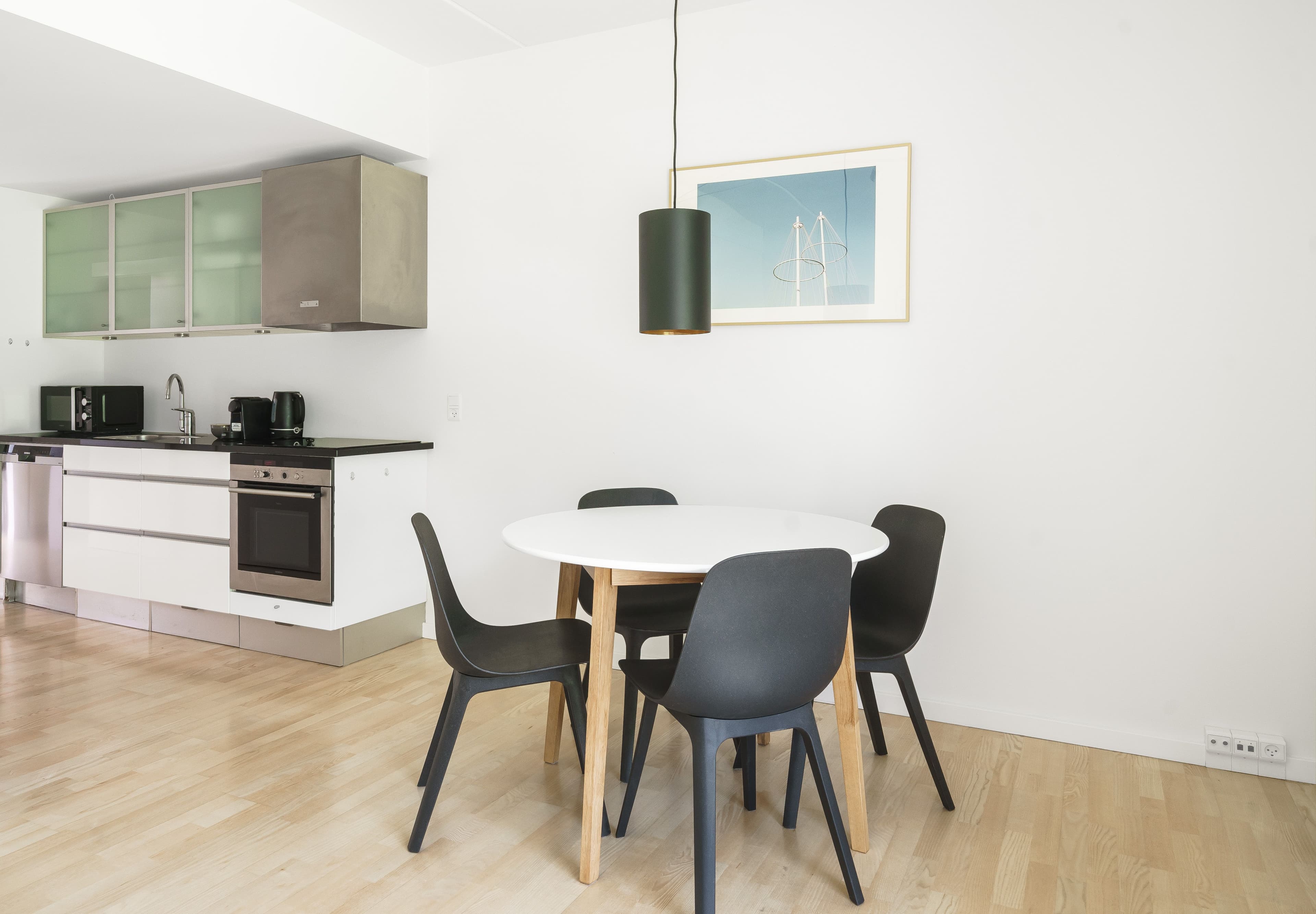 A diningtable next to the kitchen