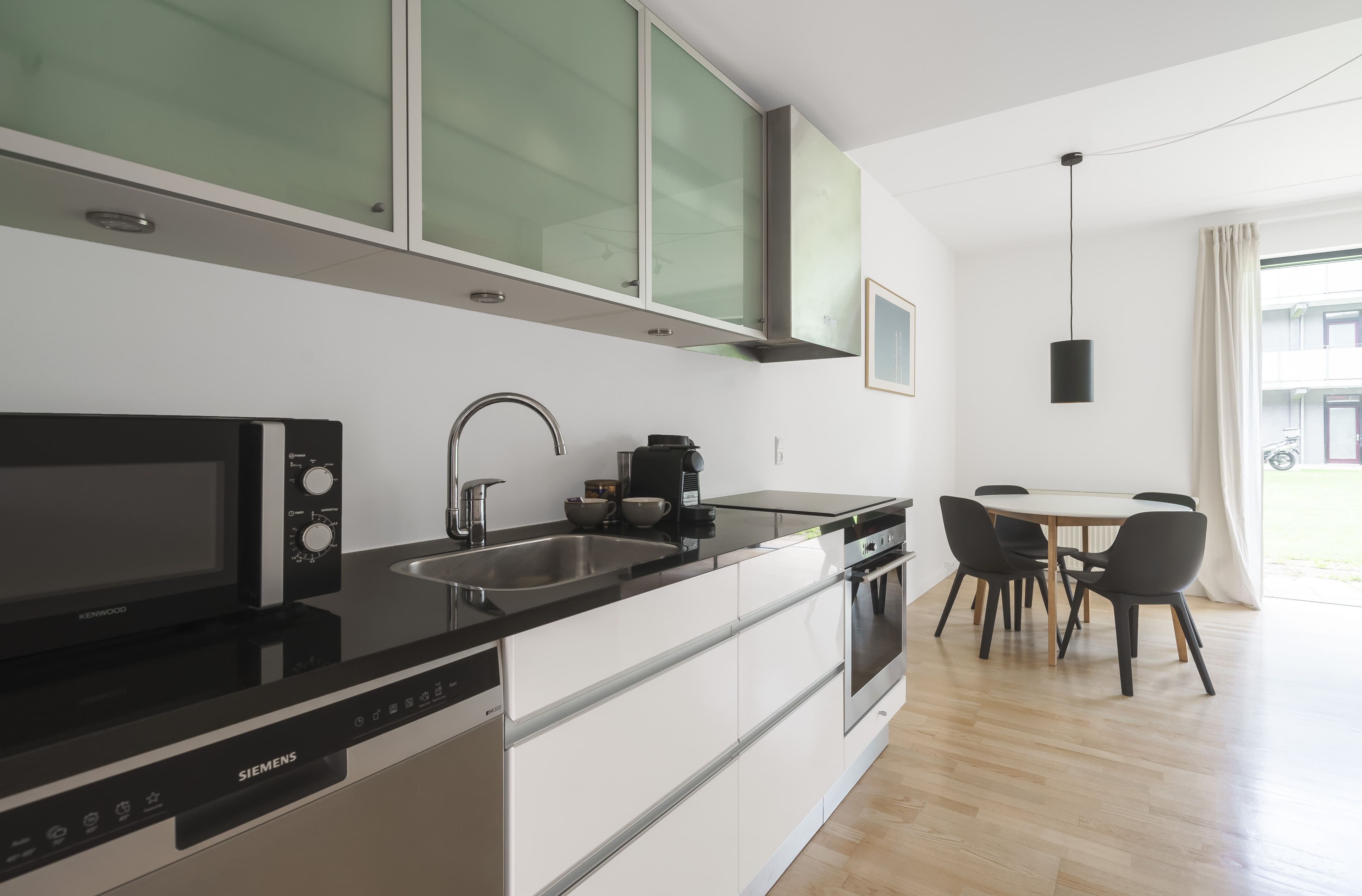 A modern kitchen with a marble countertop