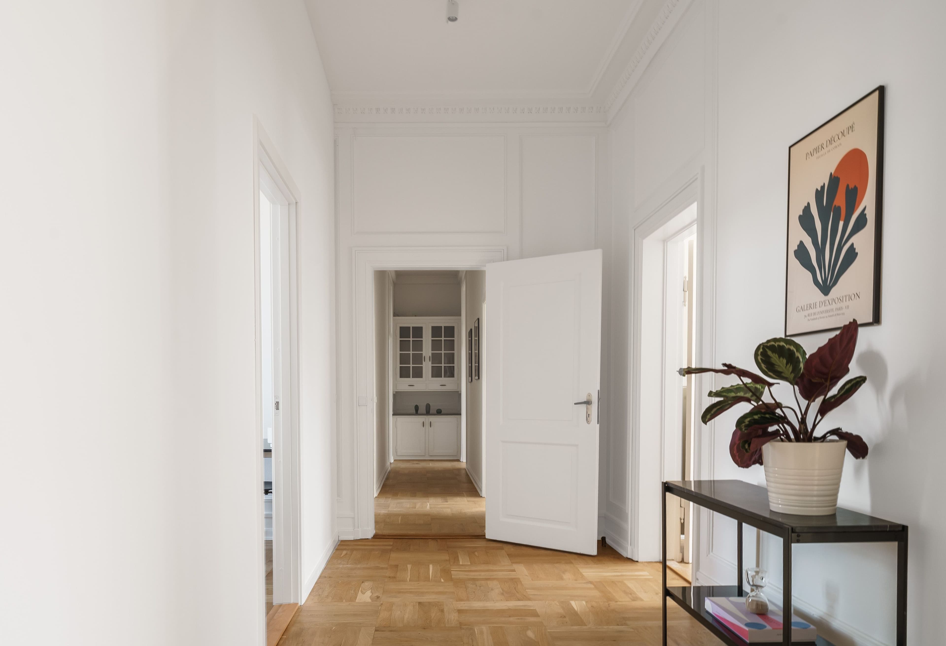 A hallway leading to a kitchen