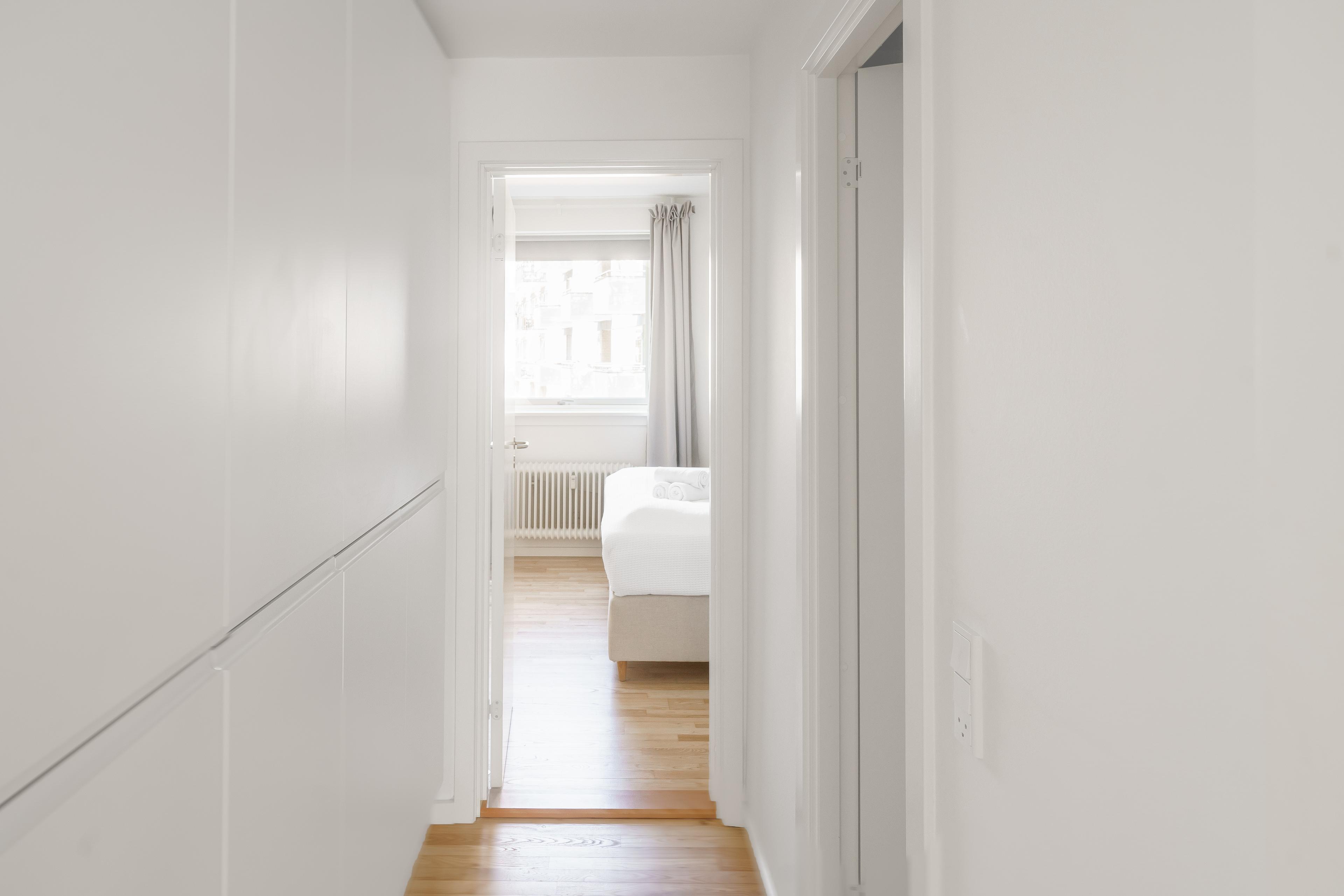 A hallway leading to a bedroom
