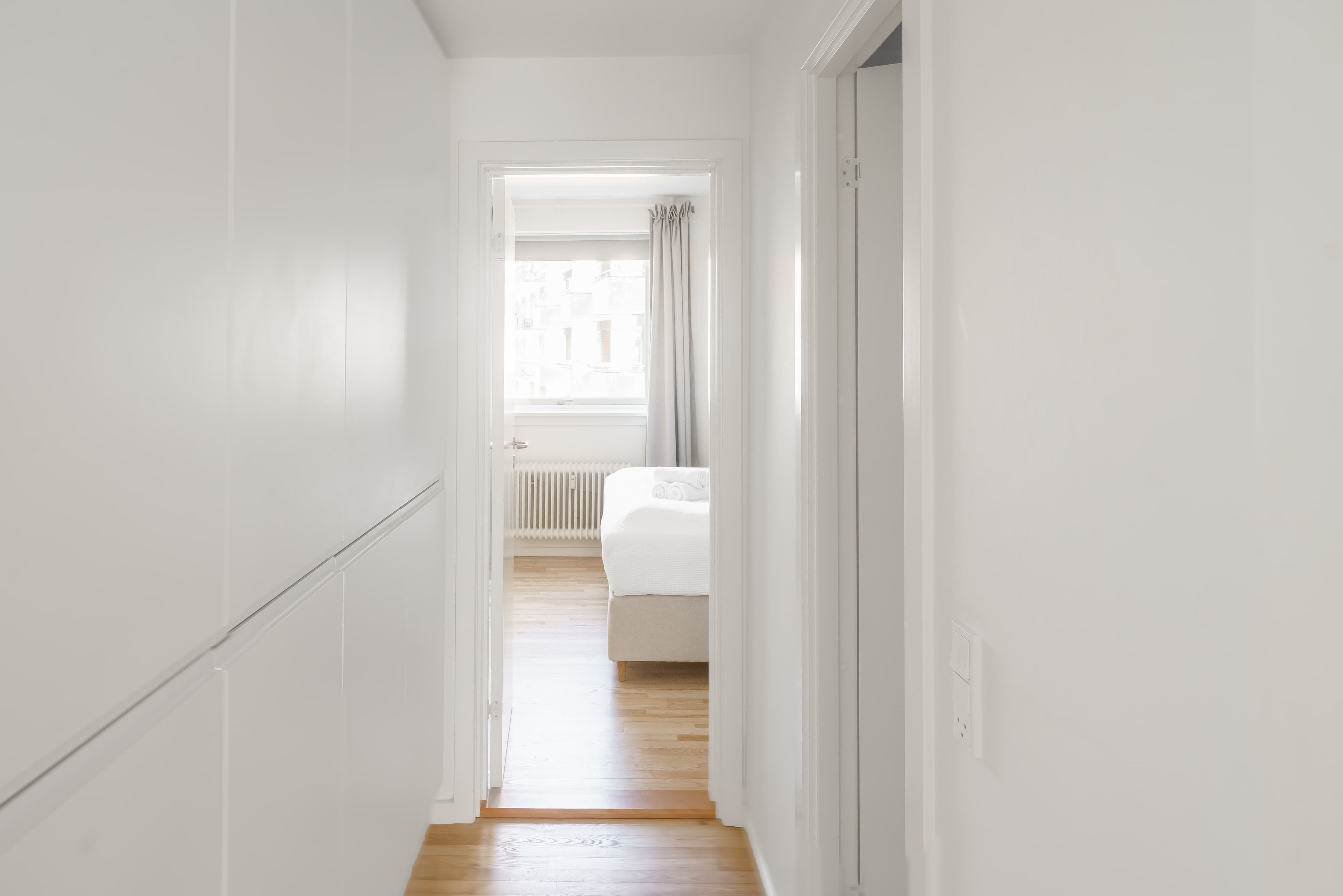 A hallway leading to a bedroom